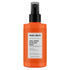 Orange spray bottle of maru-derm dual-phase blow dry spray on a white background