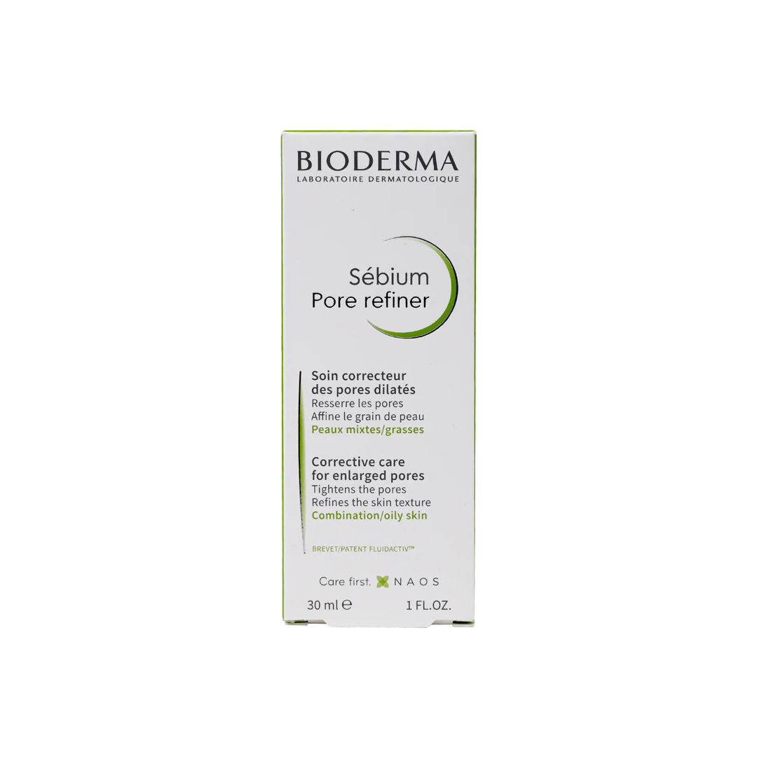 A box of BIODERMA SEBIUM PORE REFINER, 30ML, with product information in French. The packaging is primarily white and green with text and branding.