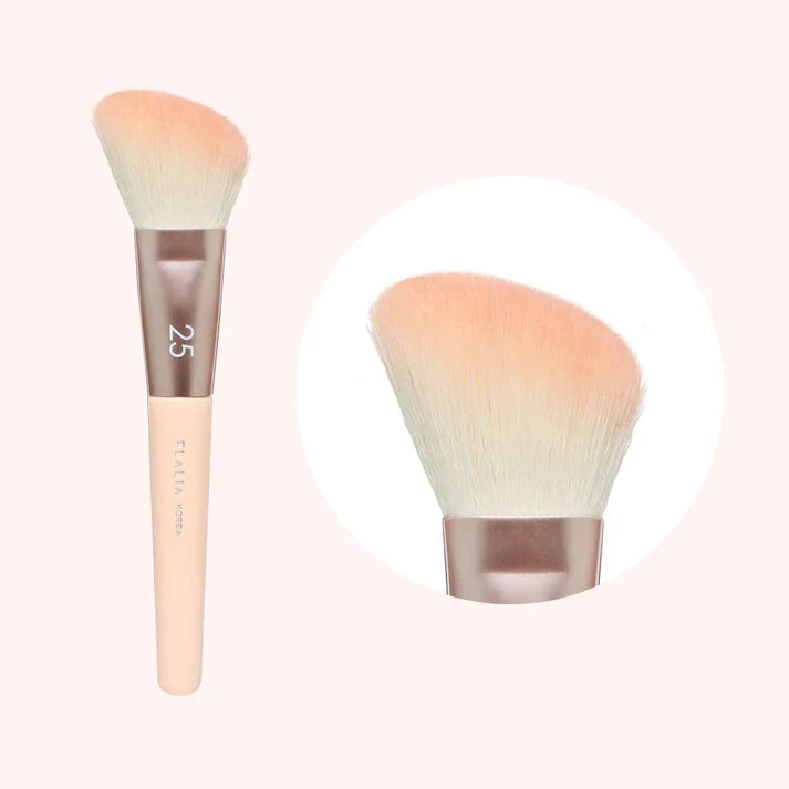 A makeup brush with a pink handle and beige bristles, labeled with the number 25.
