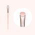 A makeup brush with a flat, wide shadow brush head, predominantly beige in color with a metallic silver handle.